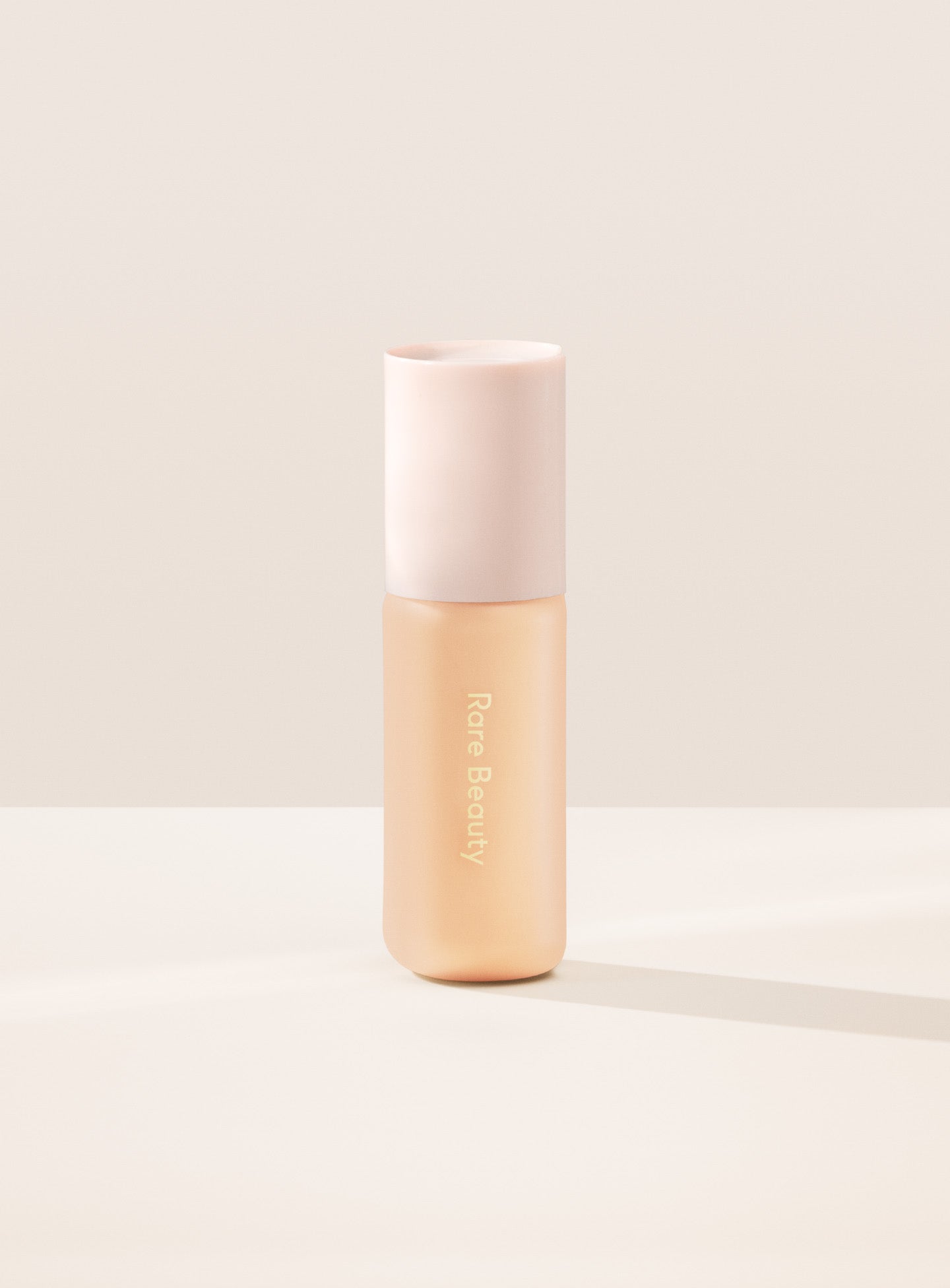14W| Shade 14W, Light with Warm Golden Undertone, of Rare Beauty's Positive Light Tinted Moisturizer with SPF.